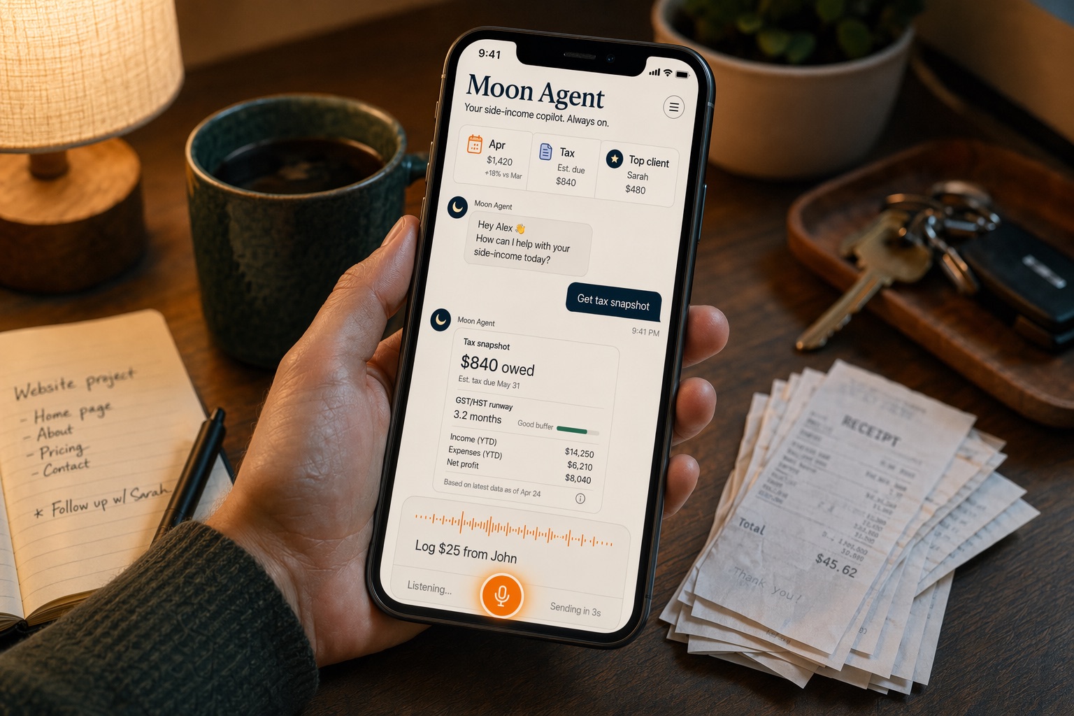 A phone showing the Moon finance chat app on a warm desk with receipts and coffee.